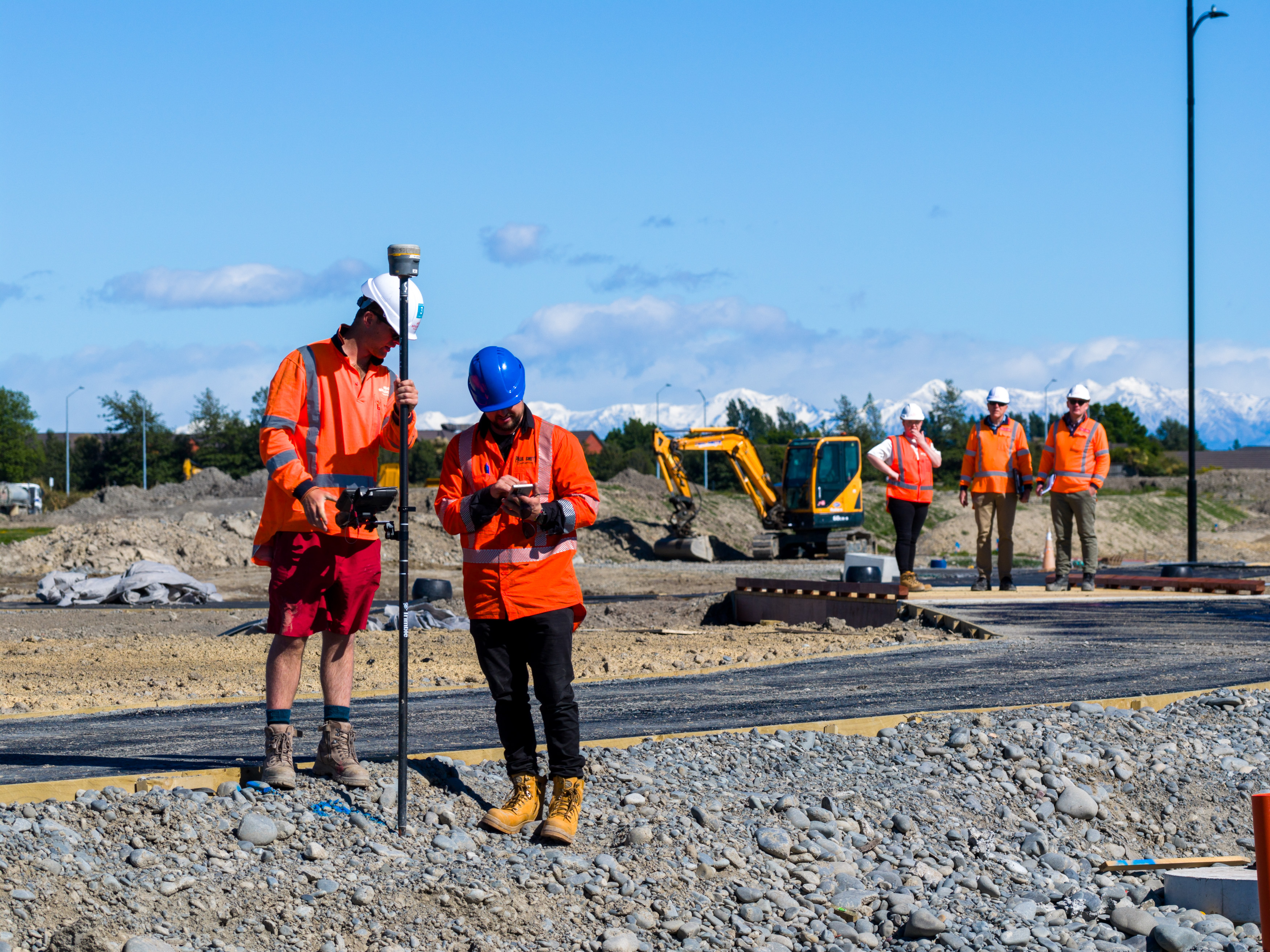 A group of Eliot Sinclair Surveyors and Engineers monitor the construction of roading and pavements in Christchurch, NZ